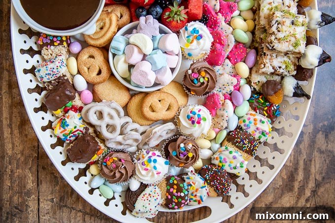 A close-up illustrating the artistic arrangement of cookies and other sweet treats on the dessert platter, filling the empty spaces.