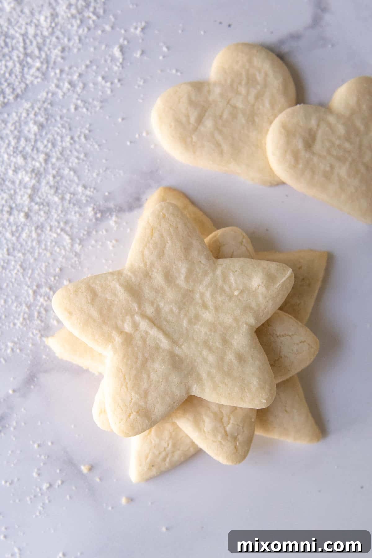 unfrosted sugar cookies on white marble