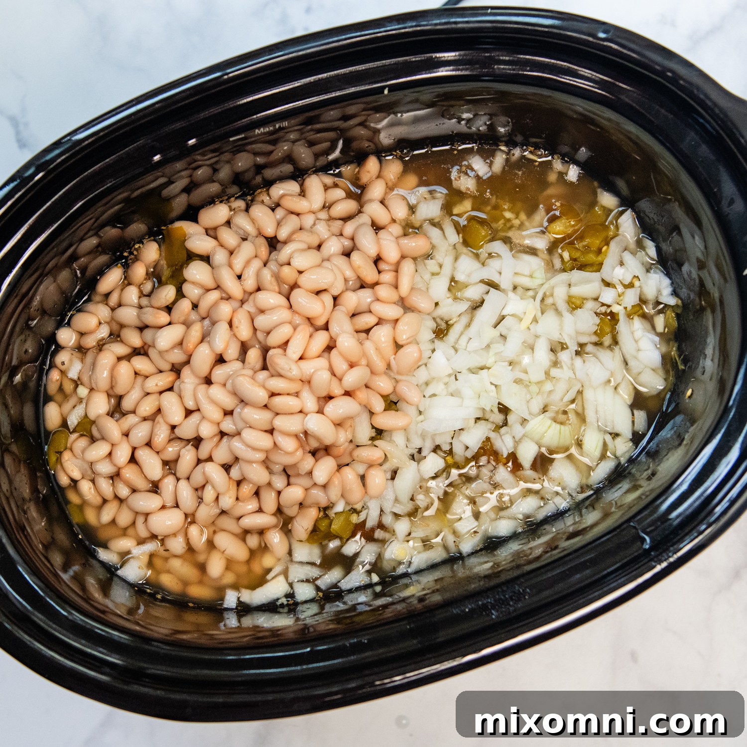 All the ingredients layered in a crock pot.
