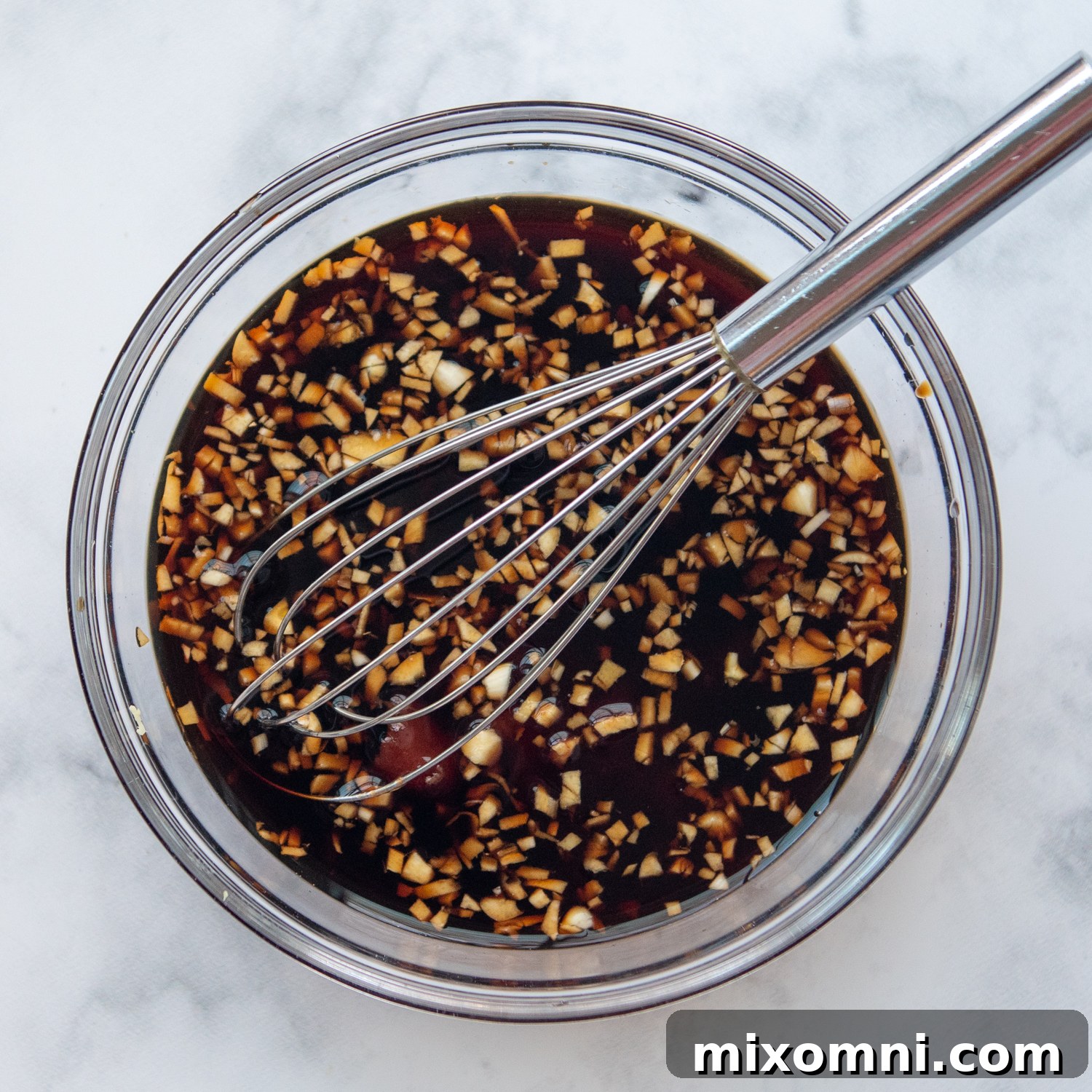 the ingredients for the honey soy sauce in a small bowl with a whisk.