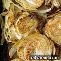overhead shot of roasted cabbage on a baking sheet
