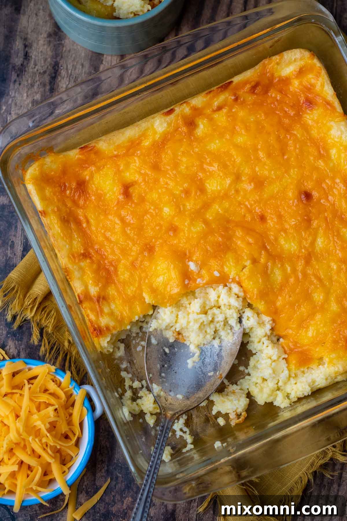 overhead shot of grits casserole with cheese on top