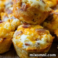 two savory muffins stacked on top of each other.