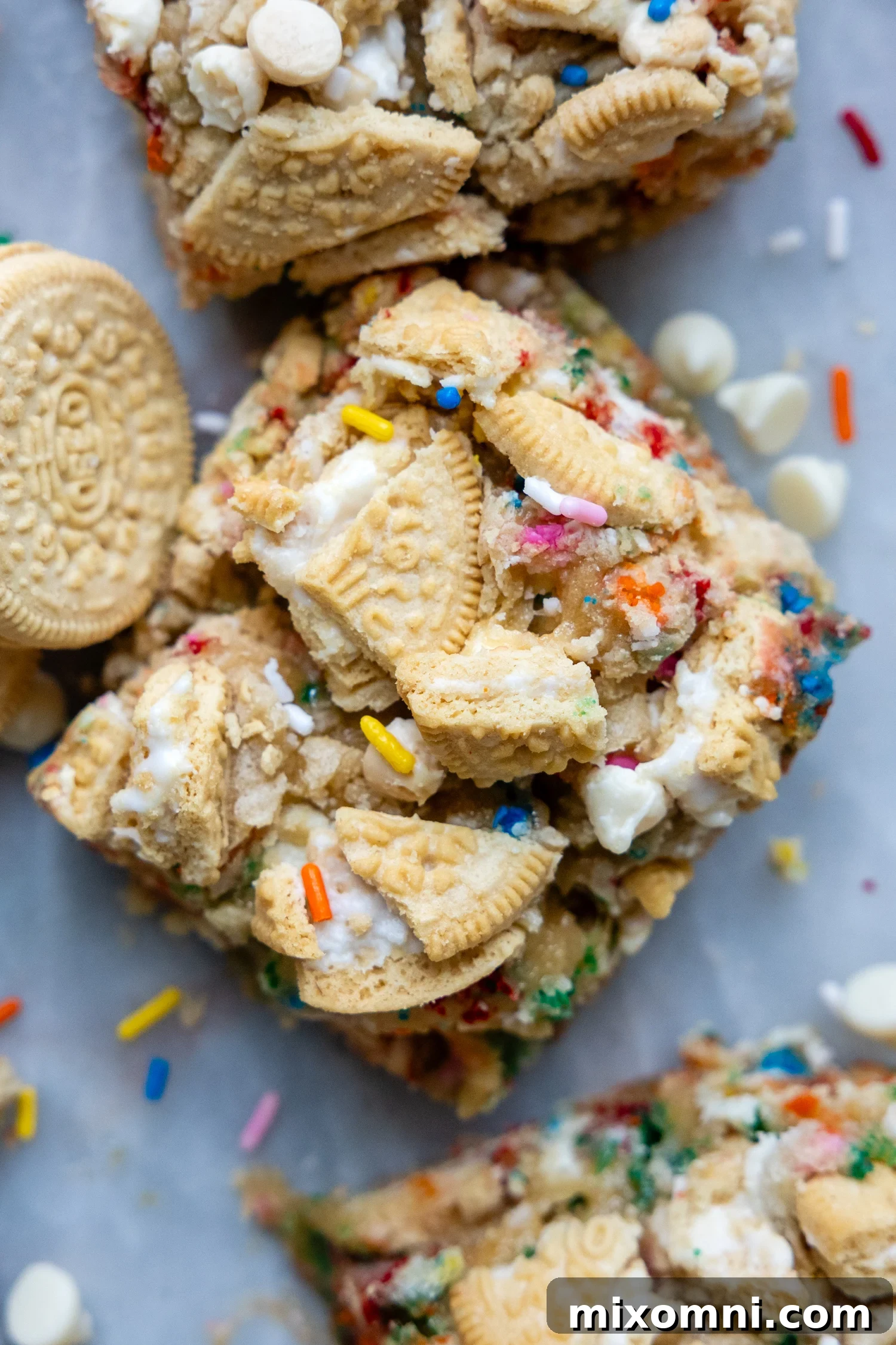 overhead shot of funfetti bars with crushed Oreos on top and a couple Golden Oreos laying next to it.